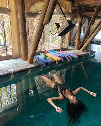 Illustration: three circular relaxation pools on a wooden deck