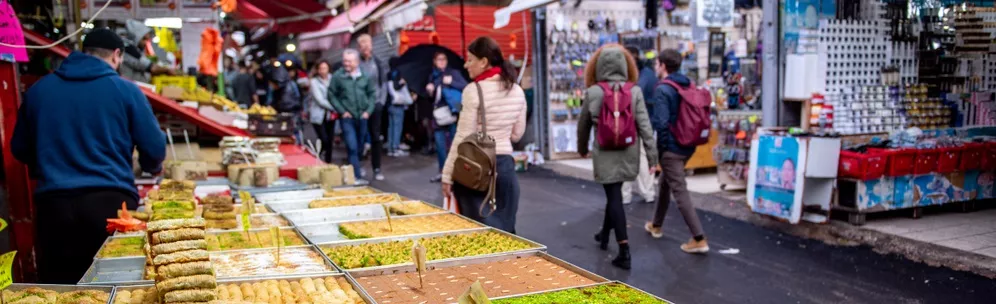 Illustrative bowls of Middle Eastern salads at a market stall