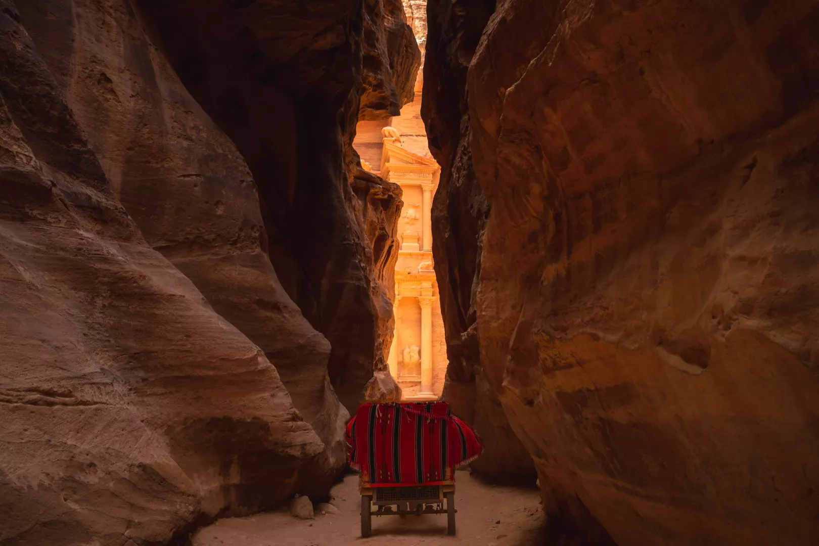 Walking the Siq on a Petra from Eilat day tour — sculpted rock, soft light